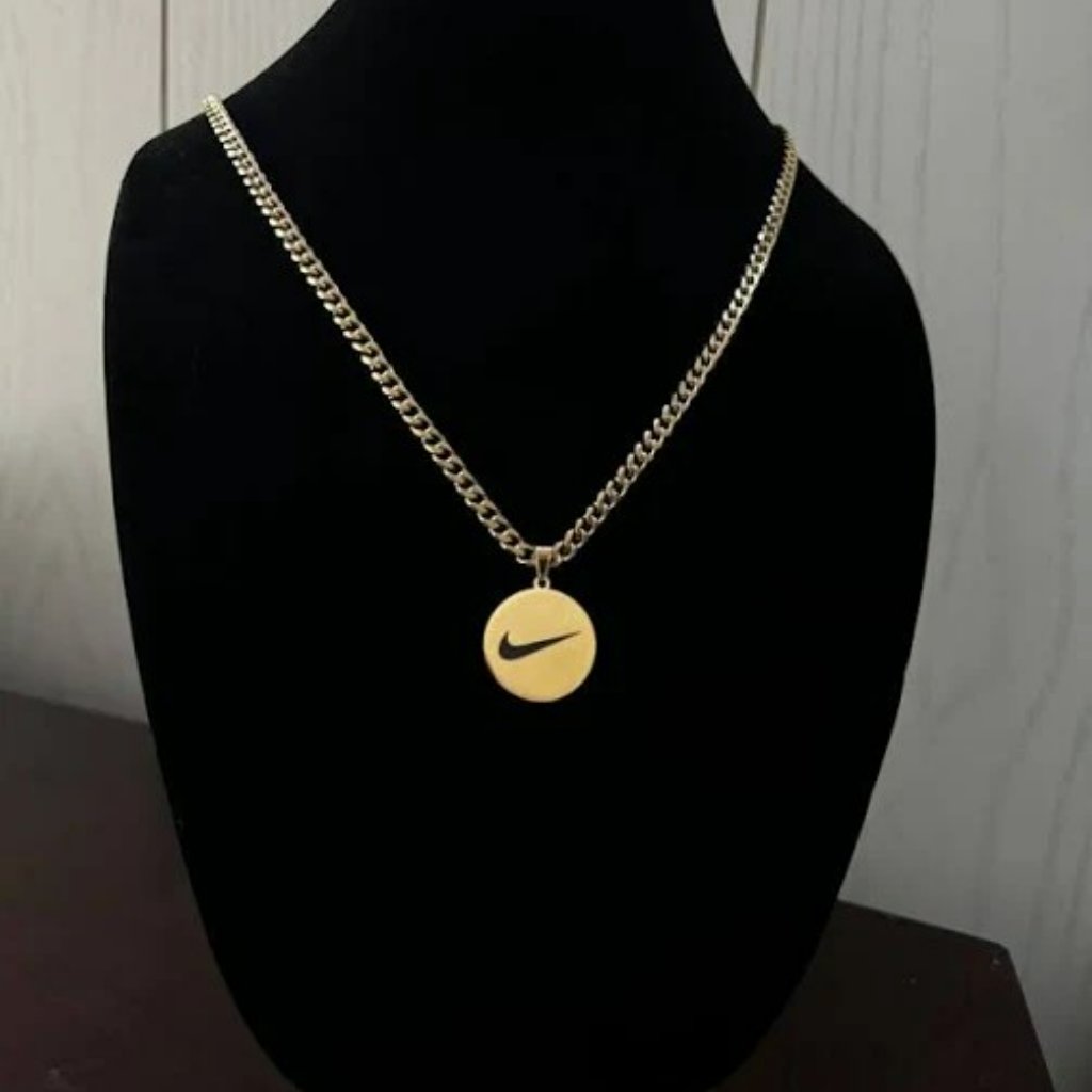 Nike: Gold Pendant And Chain